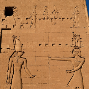 Ancient Egyptian temple relief in sunlight
