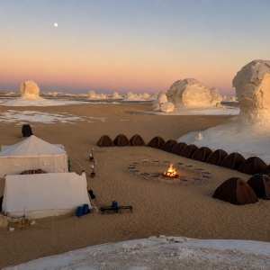 Desert camp under a pastel sky