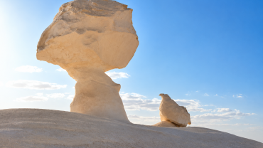 Desert hoodoos under bright skies