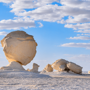 Desert rock formations under a blue sky