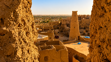 Desert town through an earthen window