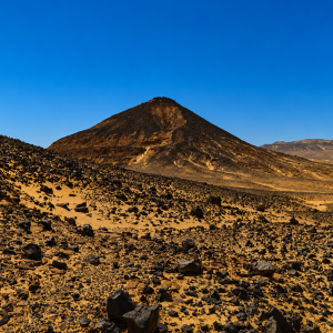 Desert volcanic landscape under clear sky