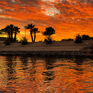 Fiery sunset over the riverbank