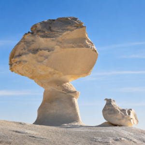 Mushroom rock formation in desert landscape