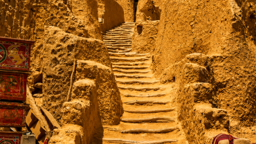 Sunlit path through ancient village
