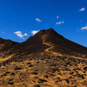 Volcanic desert under a blue sky