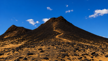 Volcanic desert under a blue sky